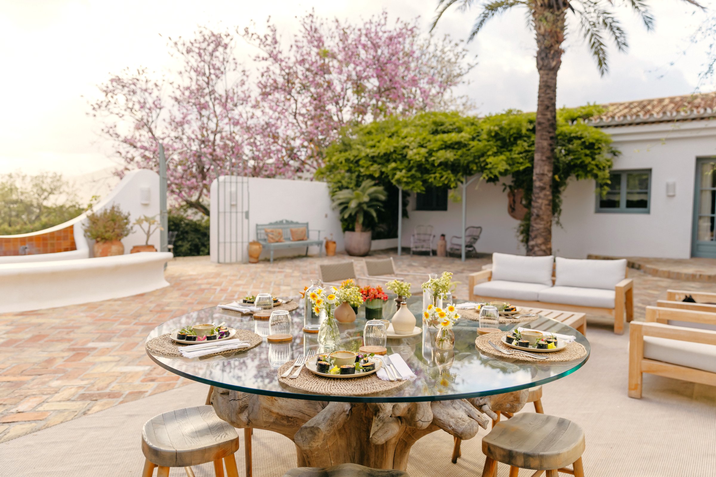 Formal Moorish garden — clipped hedges, central water feature, palms