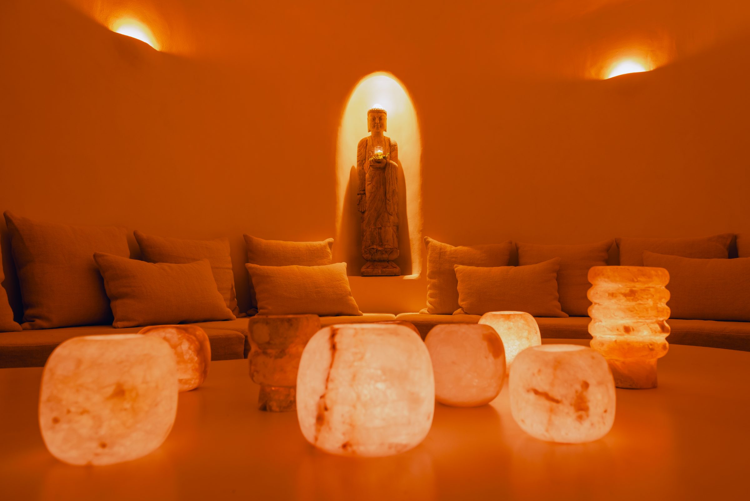 The sound healing room — crystal salt lamps, Buddha in niche
